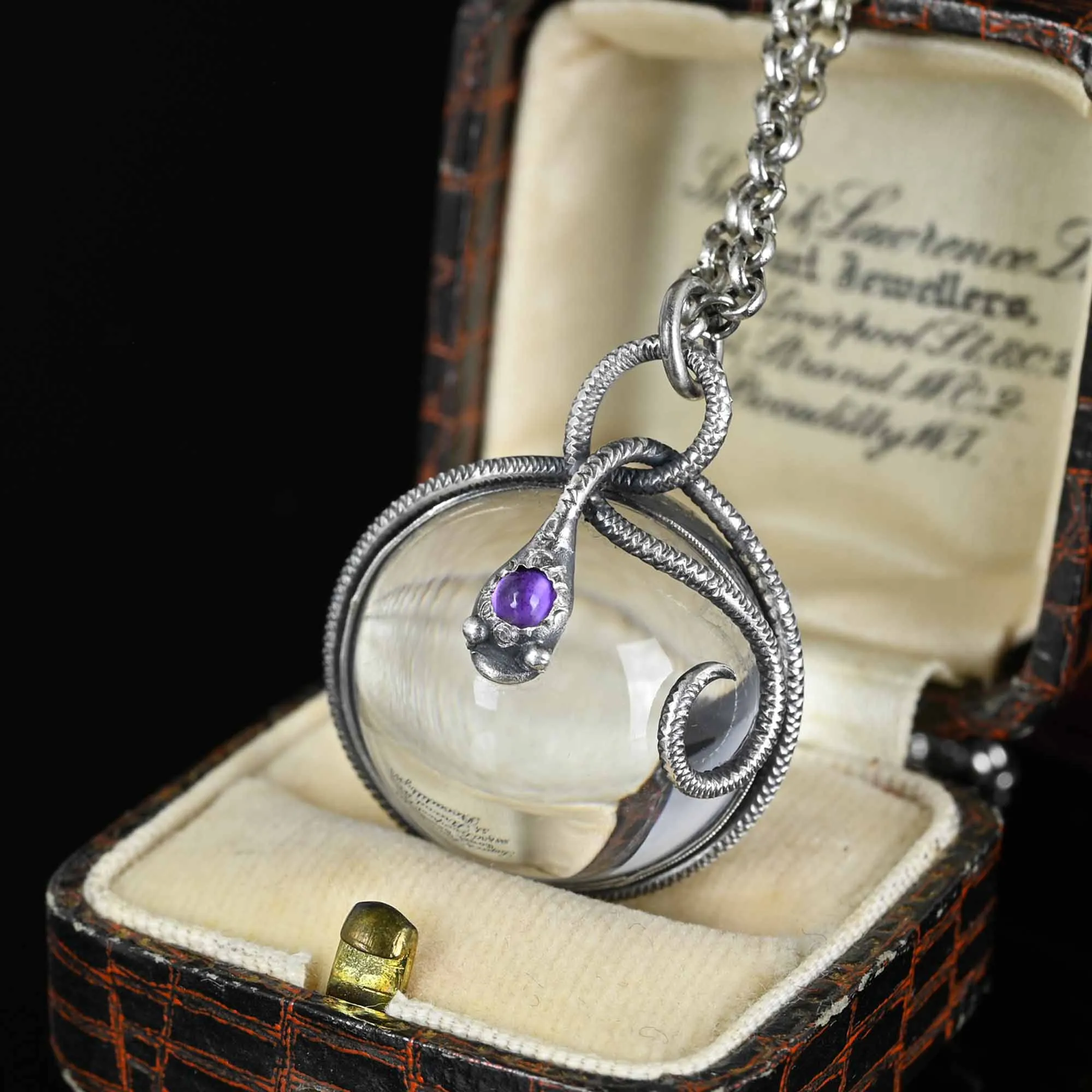 Amethyst Pools of Light Rock Crystal Snake Pendant